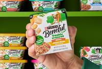 Pantry of Freshly Prepared products with a hand holding one out in the center.