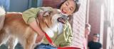Person sitting with dog