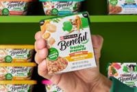 Pantry of Freshly Prepared products with a hand holding one out in the center.