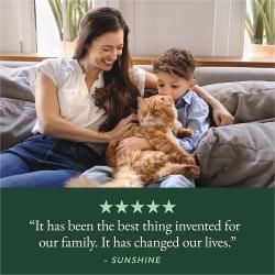 A woman and child cuddle a fluffy orange cat, with a five-star review of the life-changing Tidy Cats Breeze Litter Box System.