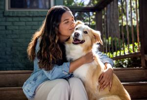woman hugging dog